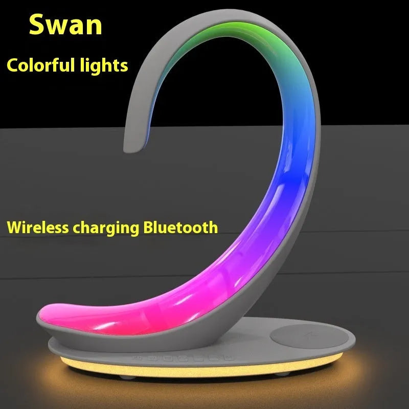 White swan shaped desktop wireless charger with Bluetooth speaker and colourful atmosphere lighting
