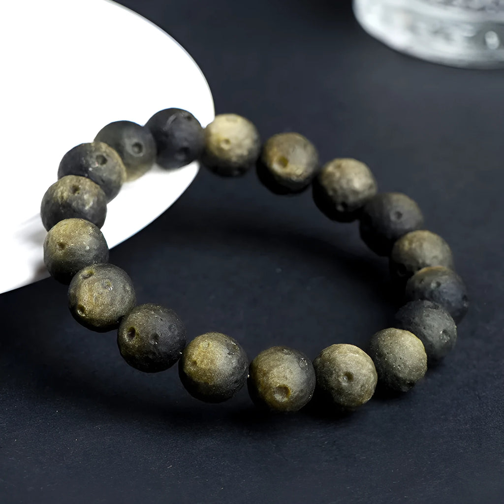 Natural obsidian crater ball bracelet with meteorite texture in silver or gold finish