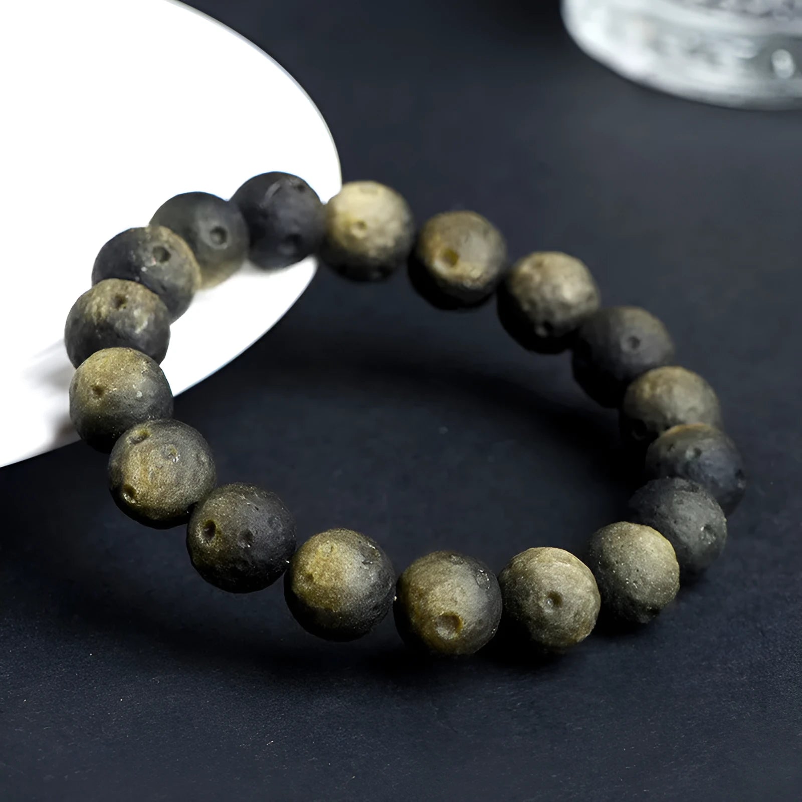 Natural obsidian crater ball bracelet with meteorite texture in silver or gold finish