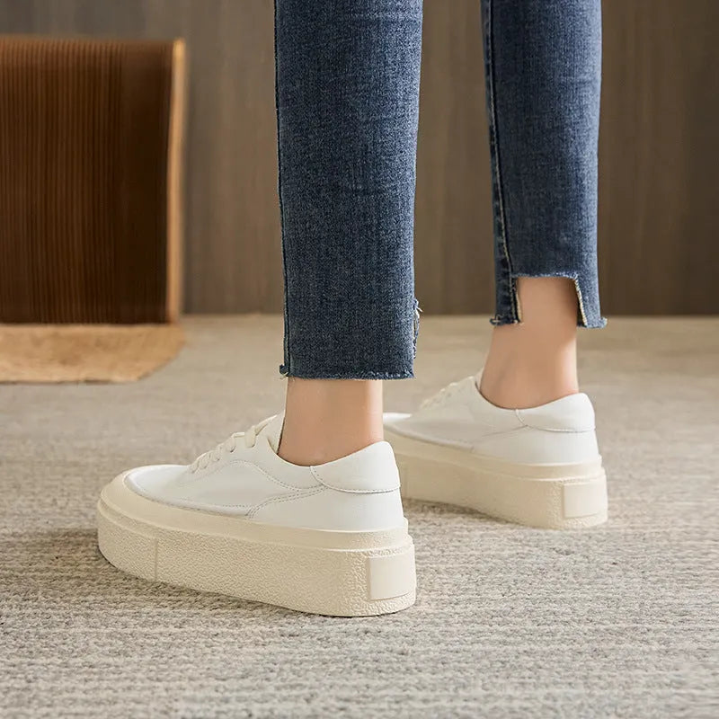 Women's black platform sports shoes with embossed cowhide leather upper and rubber sole