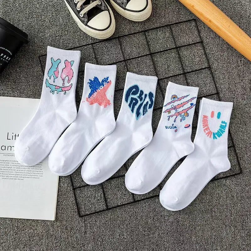10 pairs of white cotton tube socks with graffiti pattern, middle calf length, on a plain background