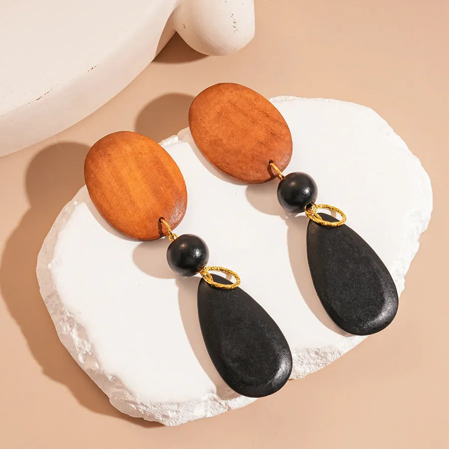 Brown-black wooden ellipse earrings with silver needle detailing in retro European American style
