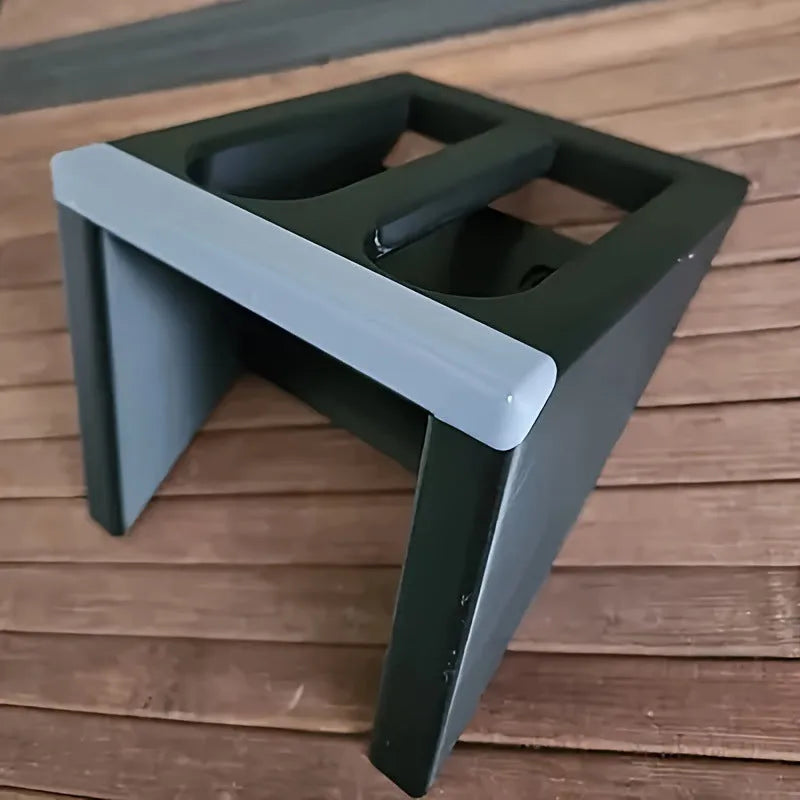 Black plastic pistol stand with punk-style design for displaying firearms