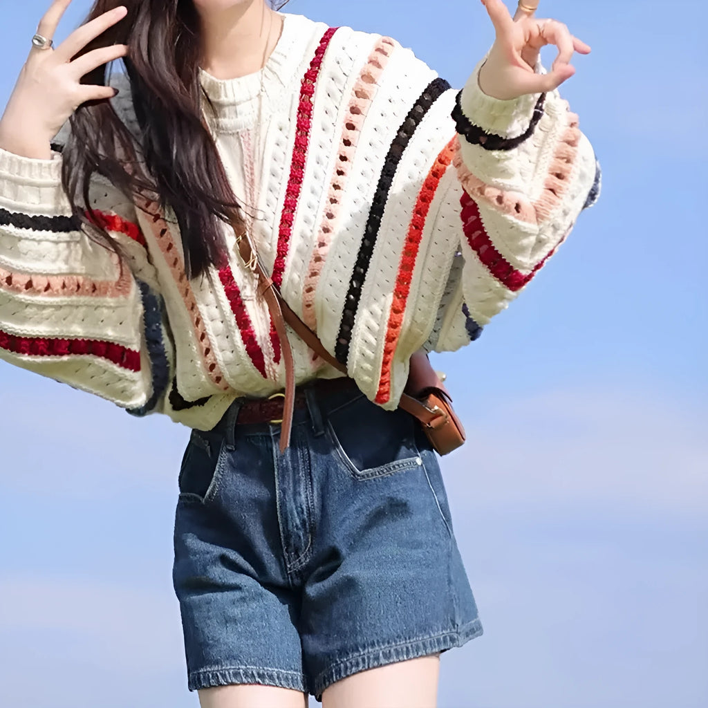 Rainbow striped hollow knit sweater with batwing sleeves and round neck