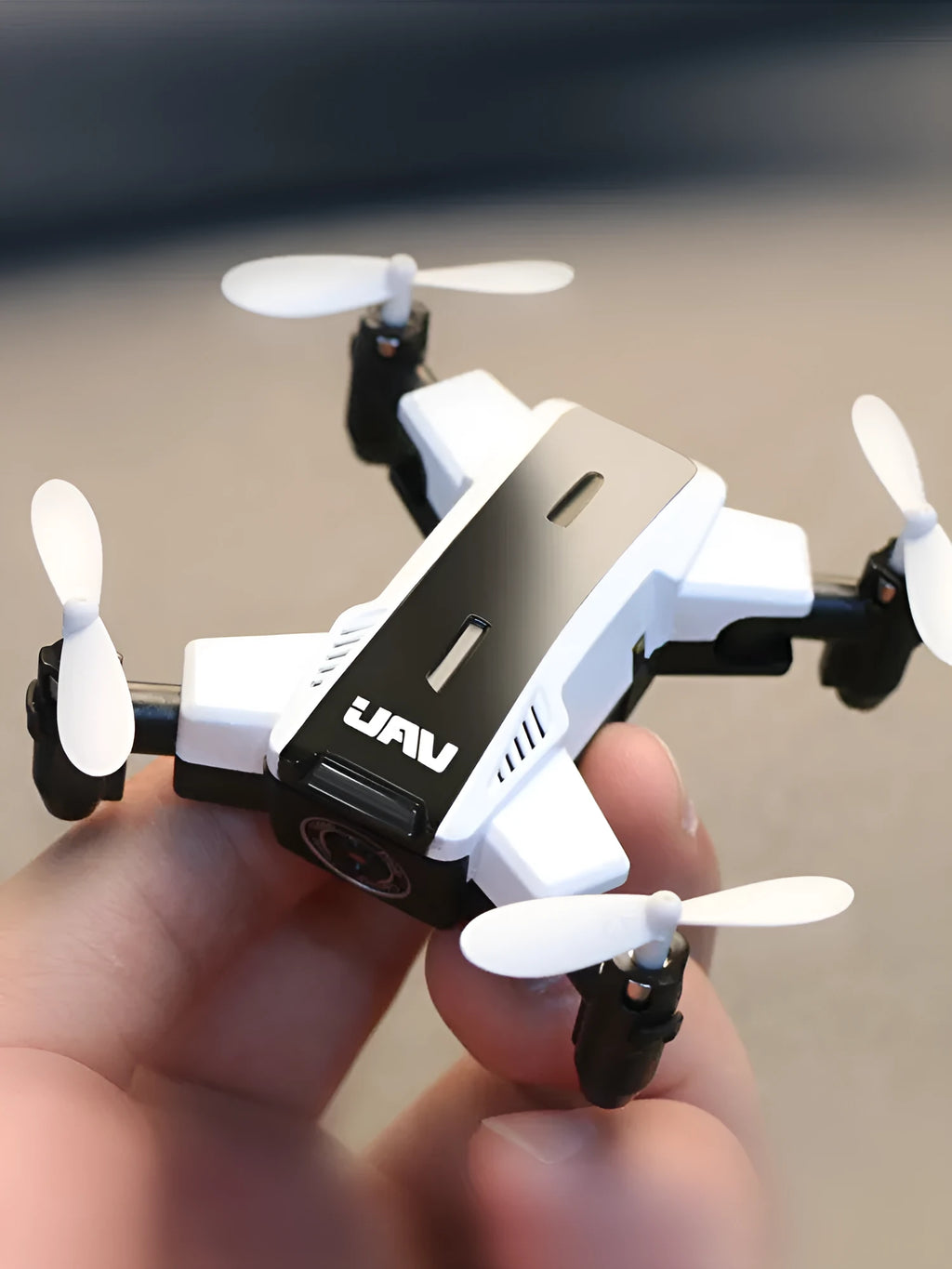 Quadcopter drone with HD 2 million pixel camera, black colour, propellers, and VR glasses on a white background