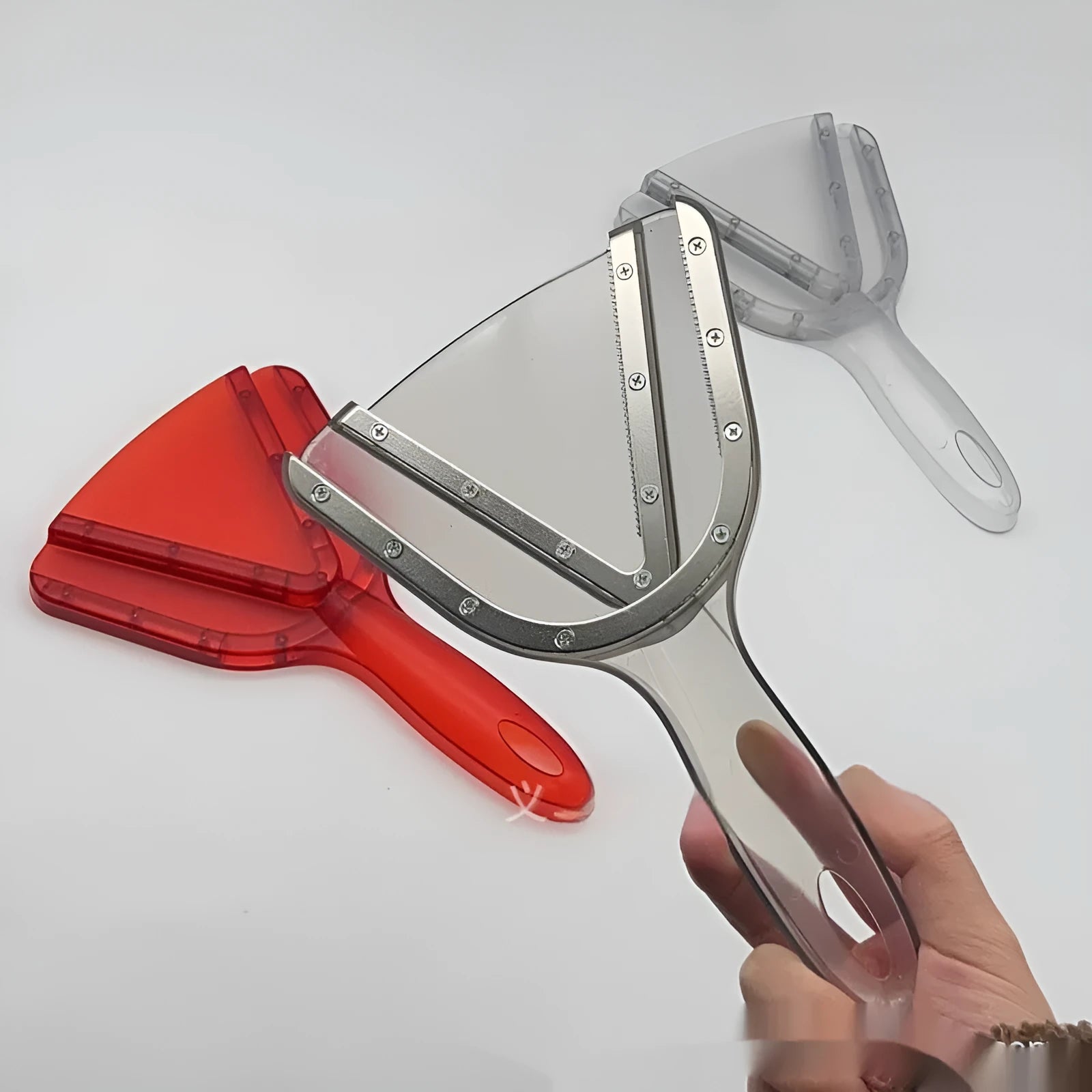 Red ABS plastic can opener and telescopic bottle opener tool on a kitchen counter.