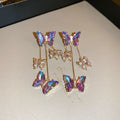 Silver needle crystal flowers butterfly tassel earrings in blue purple colour with electroplated alloy construction