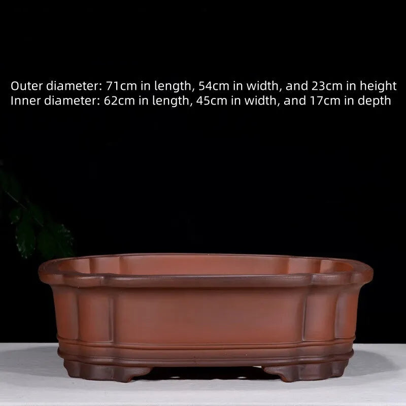 Large antique-finish Chinese purple clay flower pot with detailed tree stump and floral motif sculpture.