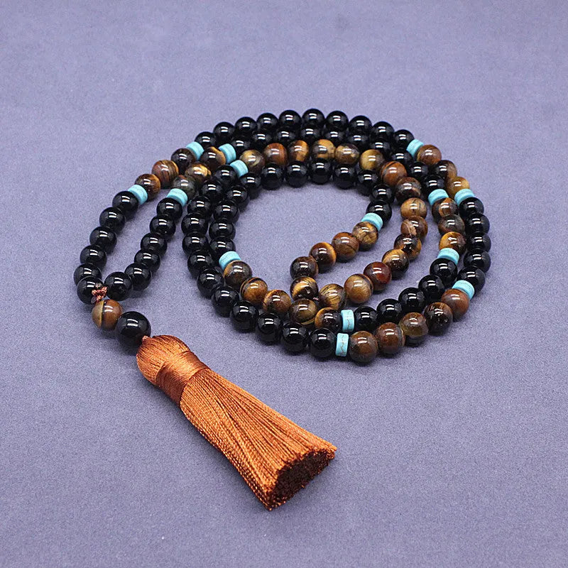 Natural agate and tigereye bead jewellery set showing black agate bracelet and necklace with tiger-shaped stone.