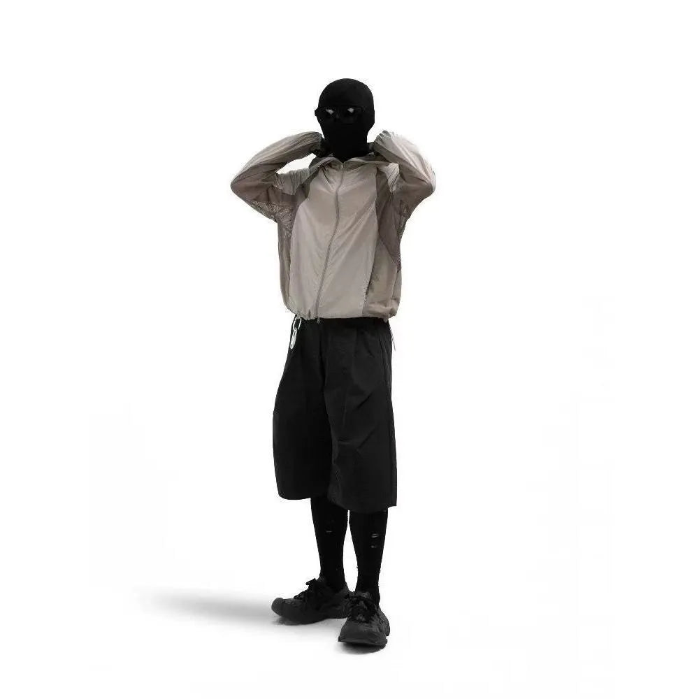 Mesh fabric sun protective clothing in desert brown colour, shown in a regular length fit.