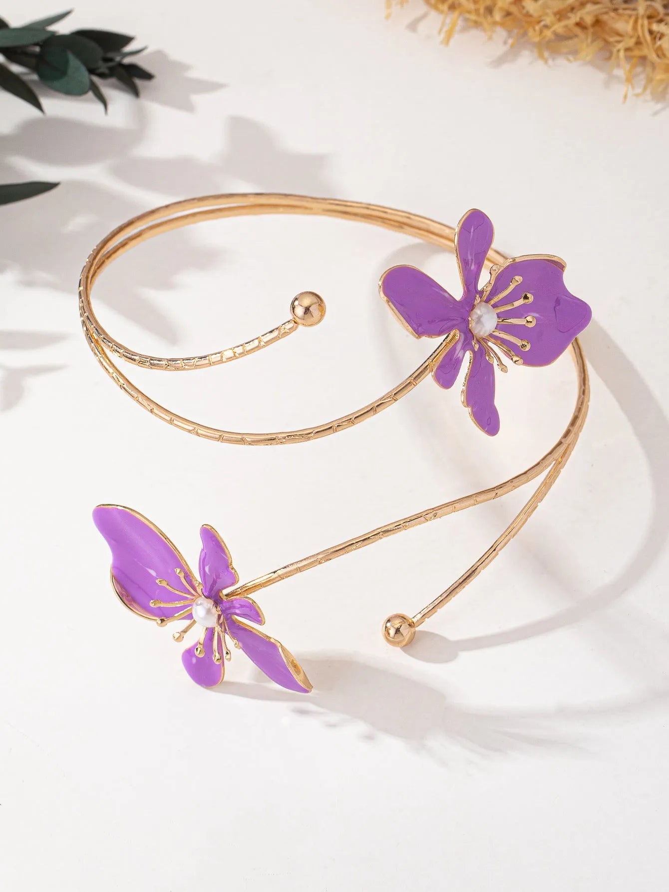 Alloy hollow armband bracelet with pattern lines shown in pink and purple colour options