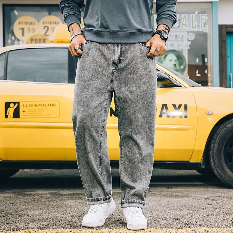 Men's loose straight jeans in cotton fabric showing mid waist fit and straight leg cut
