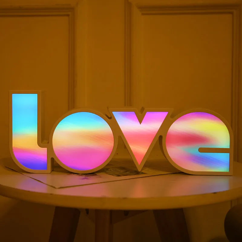 Rainbow style LED LOVE decorative light on a tabletop