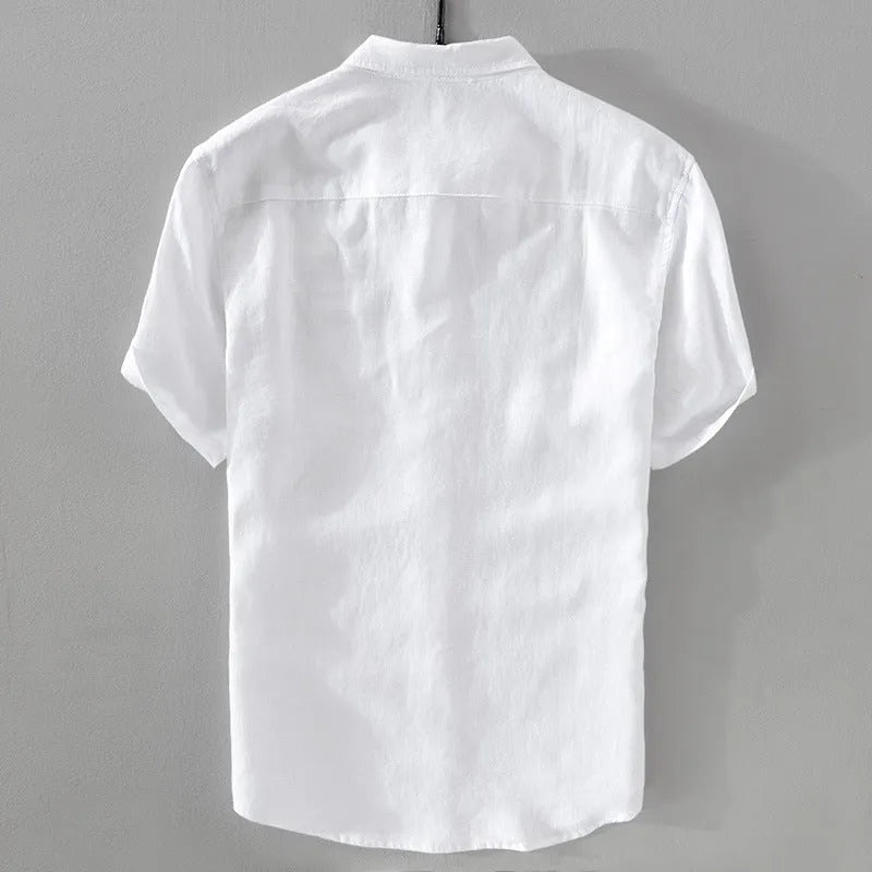 Man wearing a loose fit apricot coloured short sleeve linen blend casual shirt.