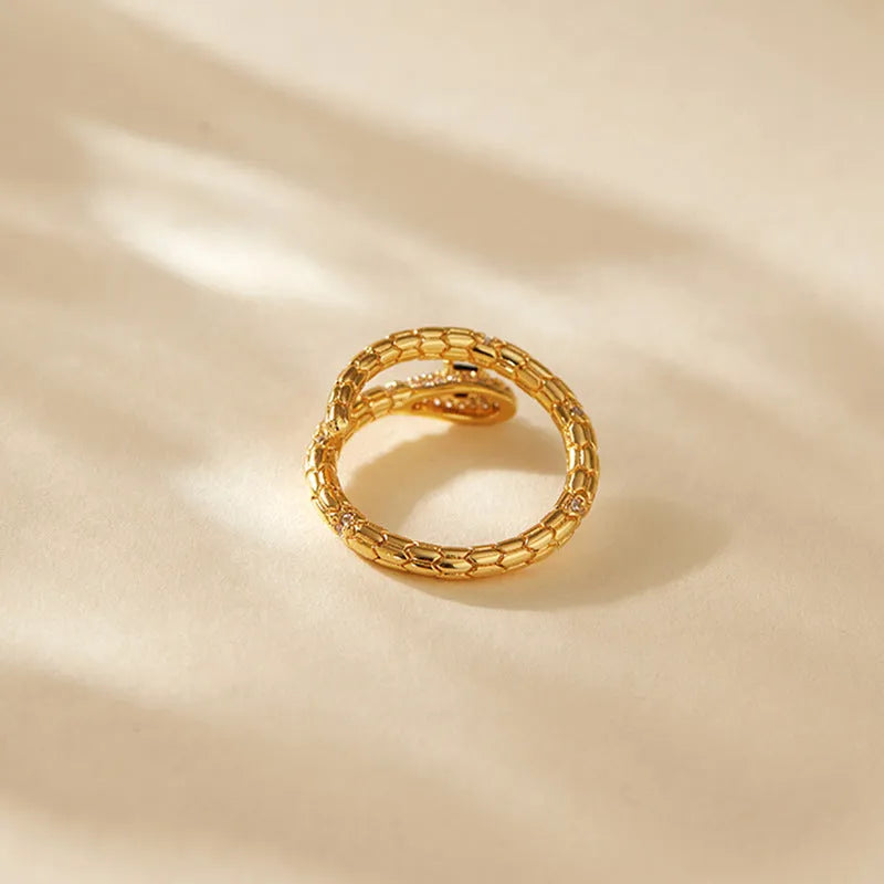 Snake-shaped adjustable index finger ring with gold colour finish and diamond-treated surface
