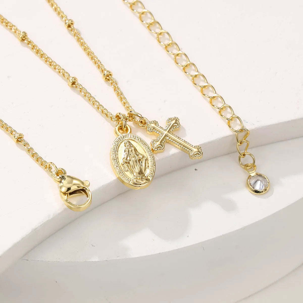 Gold geometric cross necklace with Virgin Mary ornament for women