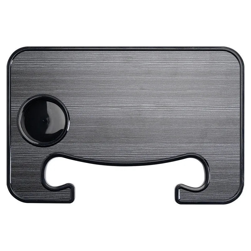Foldable black car tray stand with cup holder on a car passenger seat
