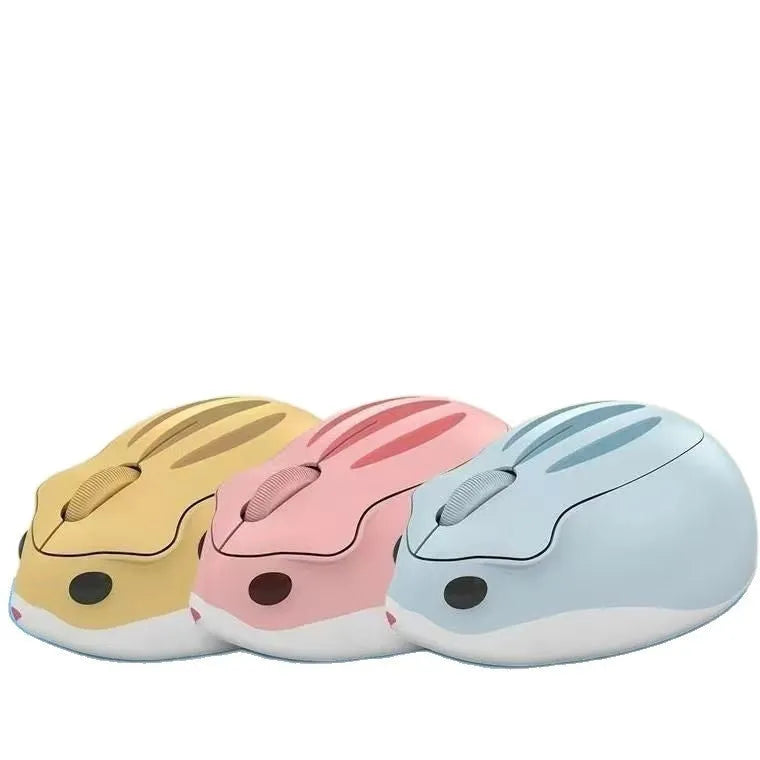 Hamster Wireless Mute Mouse in grey, pink, or yellow colour on a desk.