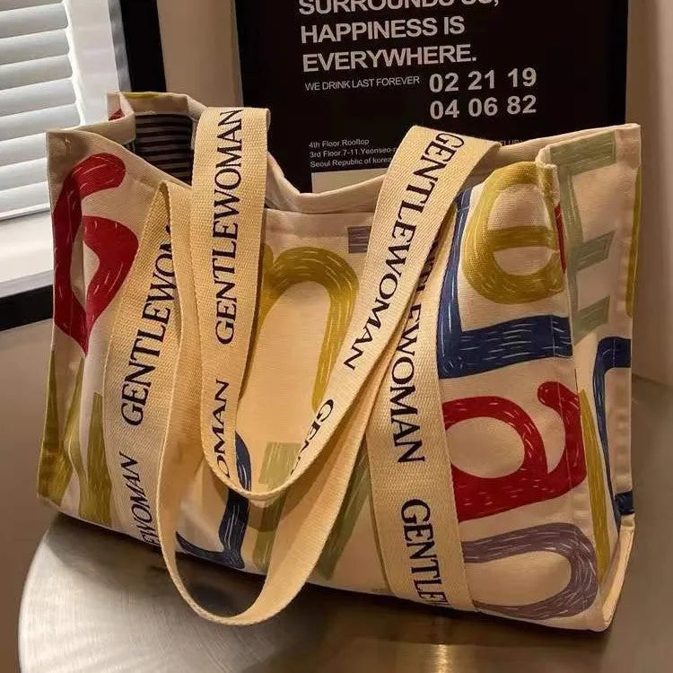A large canvas tote bag with a printed design, shown in a choice of styles.
