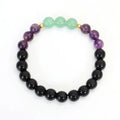 Yoga necklace with geometric lotus pendant and stone bead chain alongside a matching bracelet
