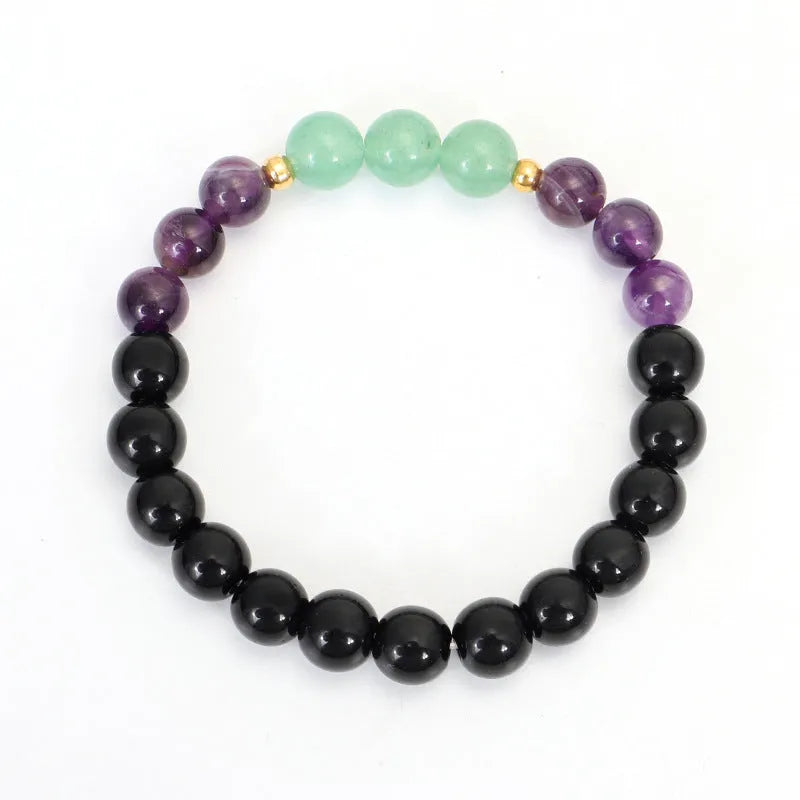 Yoga necklace with geometric lotus pendant and stone bead chain alongside a matching bracelet