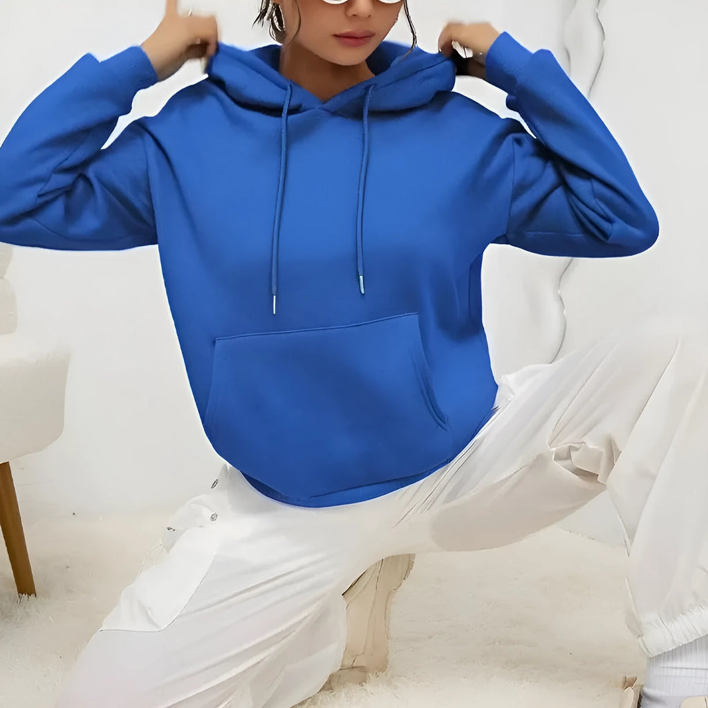 Women's loose grey drawstring hooded sweatshirt with side pockets, on a hanger.