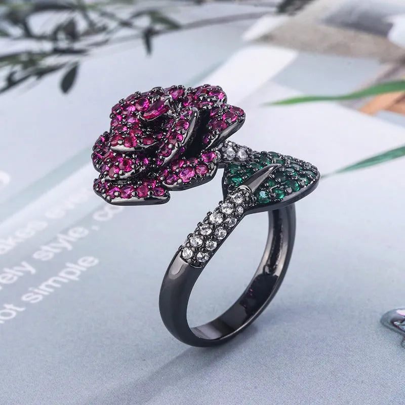 Gold-plated black gold ring with geometric shape and floral design featuring simulation red corundum elements