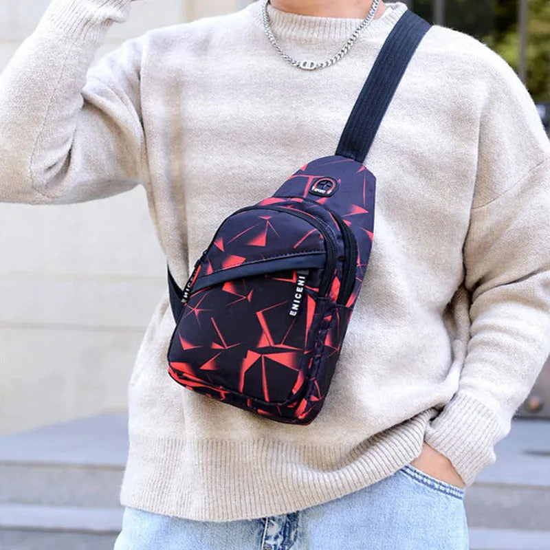 Men's black print sling chest bag with earphone hole and zipper, showing inner patch pocket.