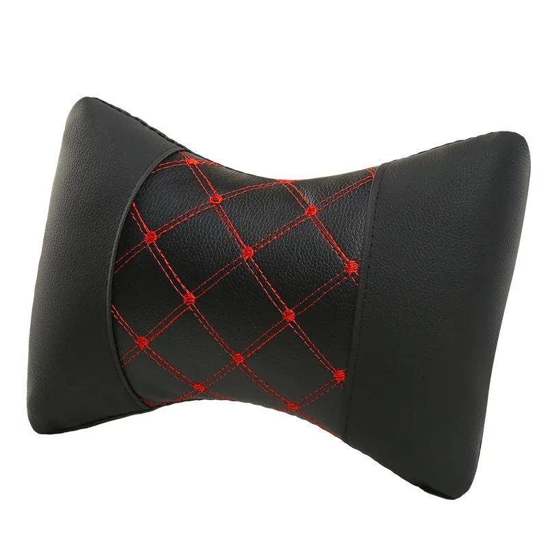 Black quilted car headrest neck pillow with diamond pattern and contrasting stitching