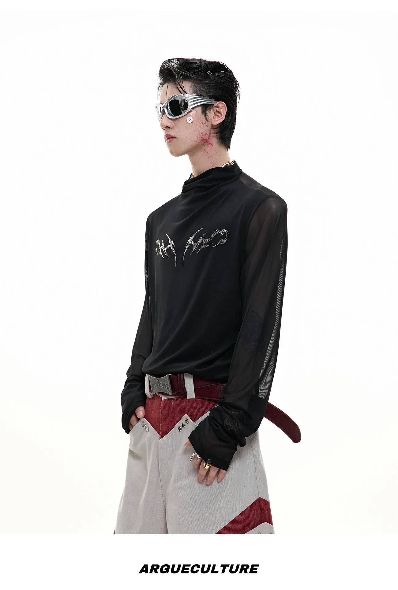 Black mesh slim-fit long sleeve base layer shirt laid flat, showing its texture and cut.
