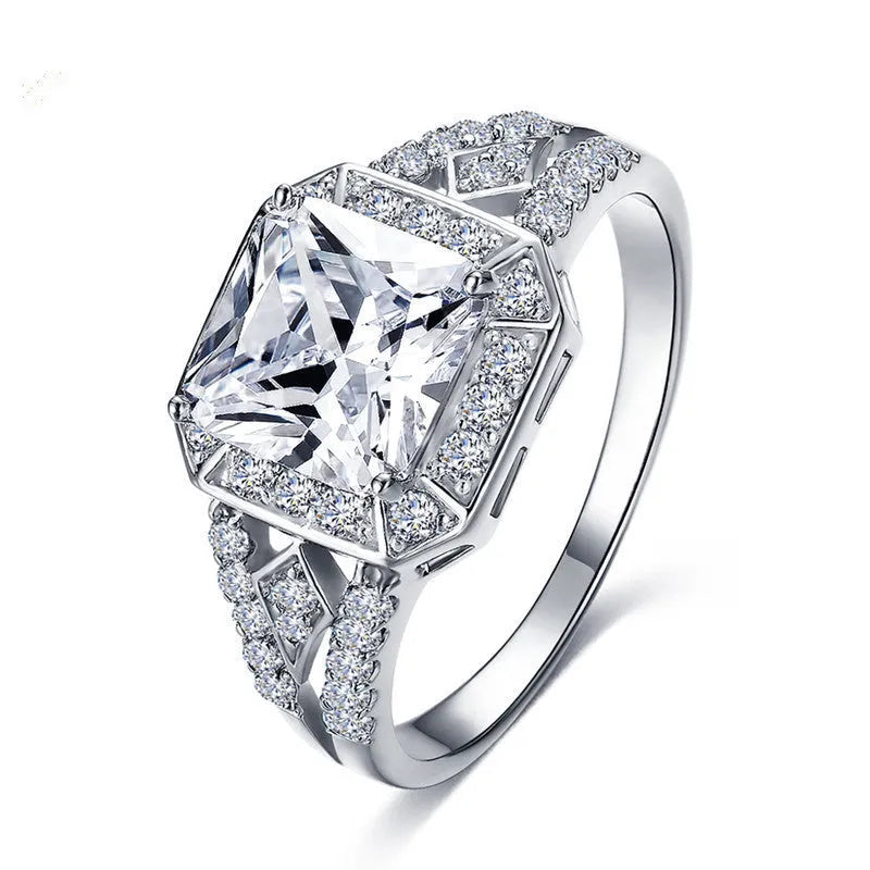 Women's geometric zircon ring with platinum finish on a copper band, showing hollow construction and quadrilateral design.