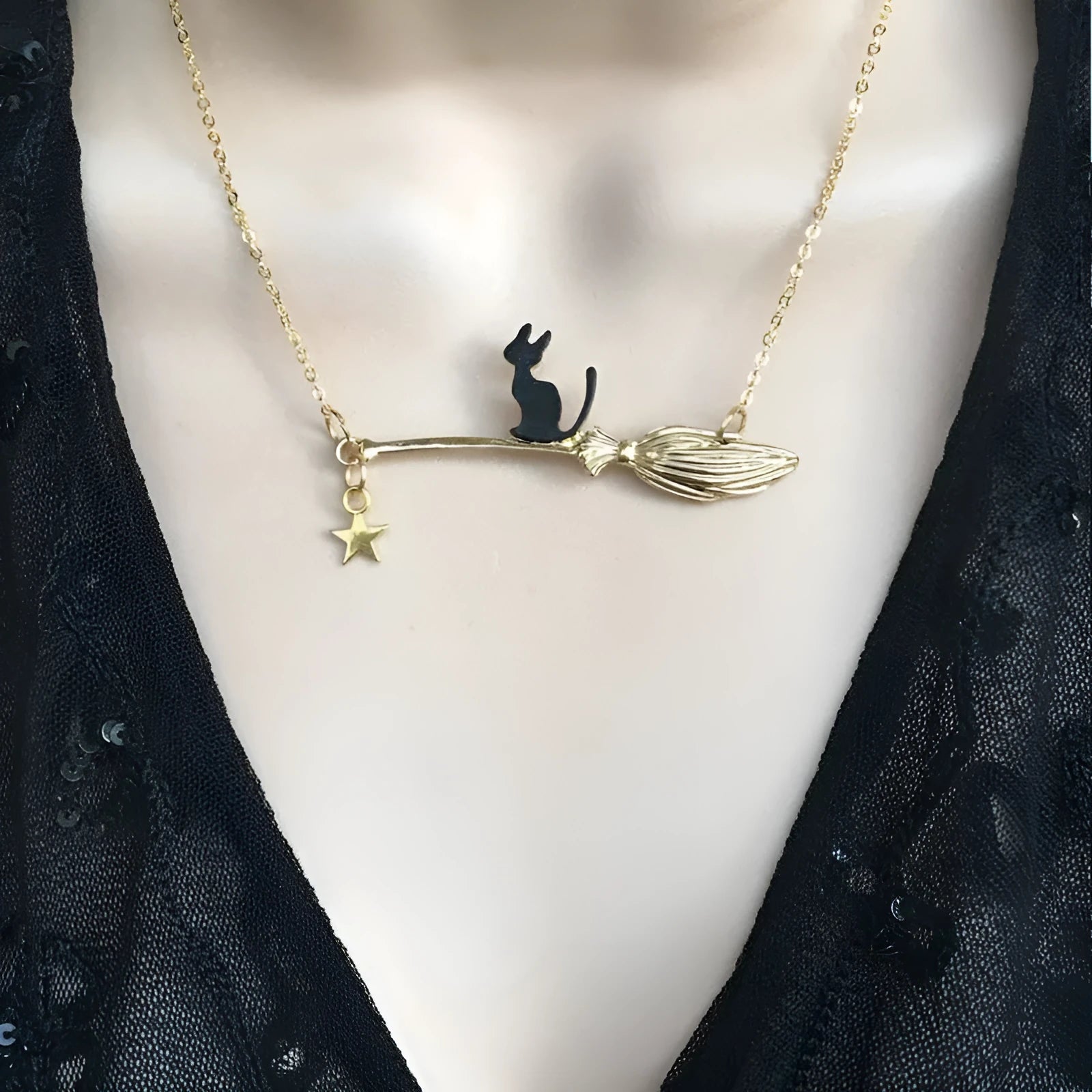 A lightweight alloy necklace with a simple black cat pendant, shown in gold and silver finish options.
