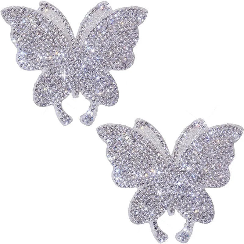 White diamond butterfly and bear claw design glass car sticker measuring 7 by 6 centimetres.