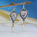 Retro blue Bohemian style drop earrings with geometric metal design, synthetic blue opal and white pearl elements