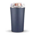 Compact blue mini flour mill and spice grinder made from stainless steel on a kitchen worktop.