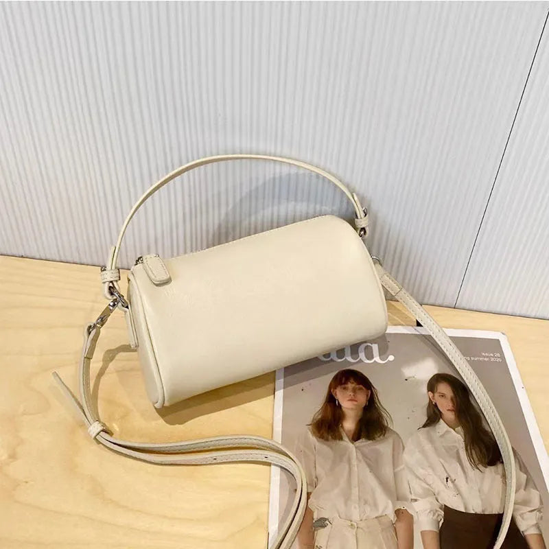 Genuine leather cylindrical crossbody phone bag in vegetable-tanned leather with single shoulder strap