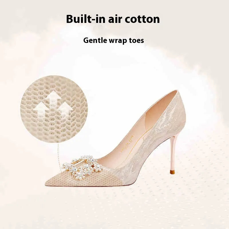 Champagne gold pointed-toe stiletto high heels with rhinestone decoration.
