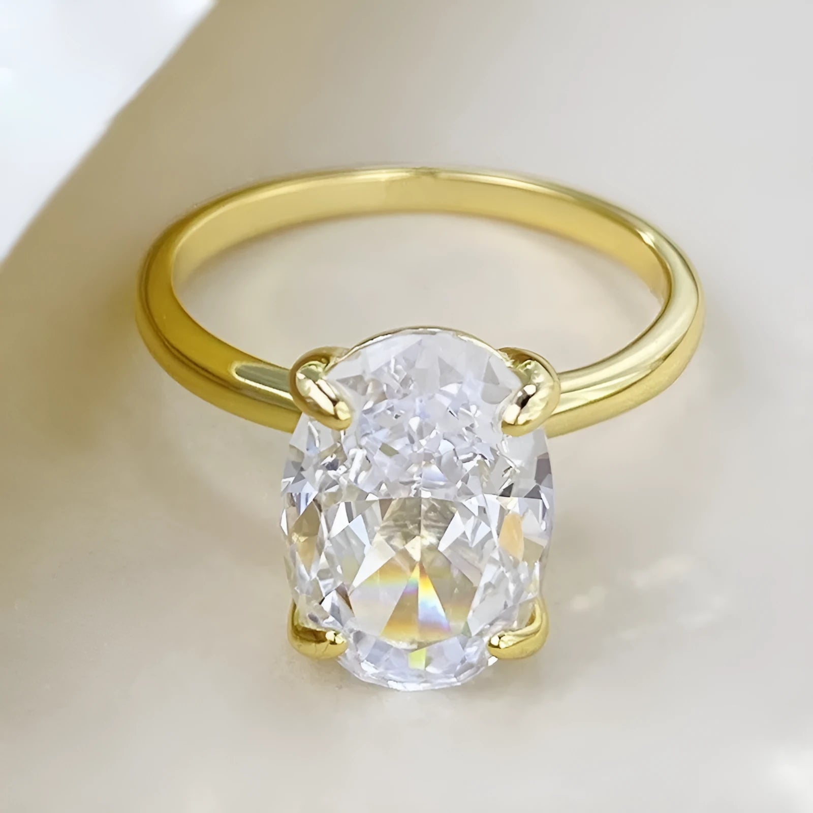 Oval women's ring with four-claw setting in 9 silver, gold and silver colour options