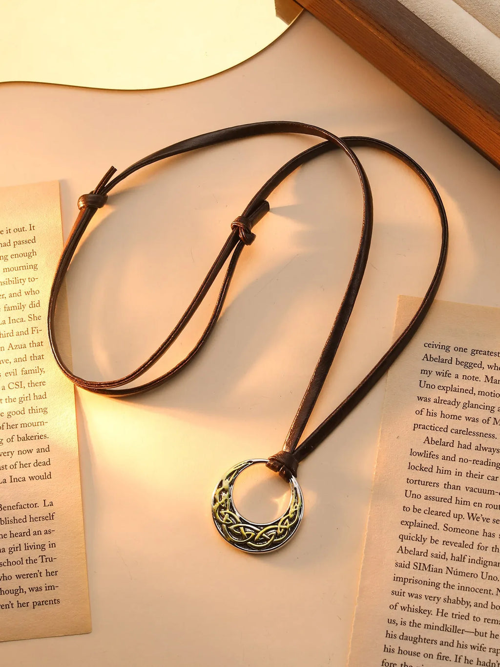 Alloy skull pendant necklace with adjustable knot chain in antique silver on a neutral background