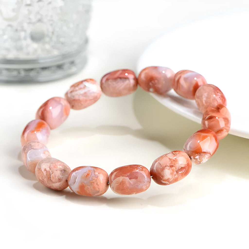 Natural cherry agate bracelet with barrel shaped beads and carved Ruyi symbols