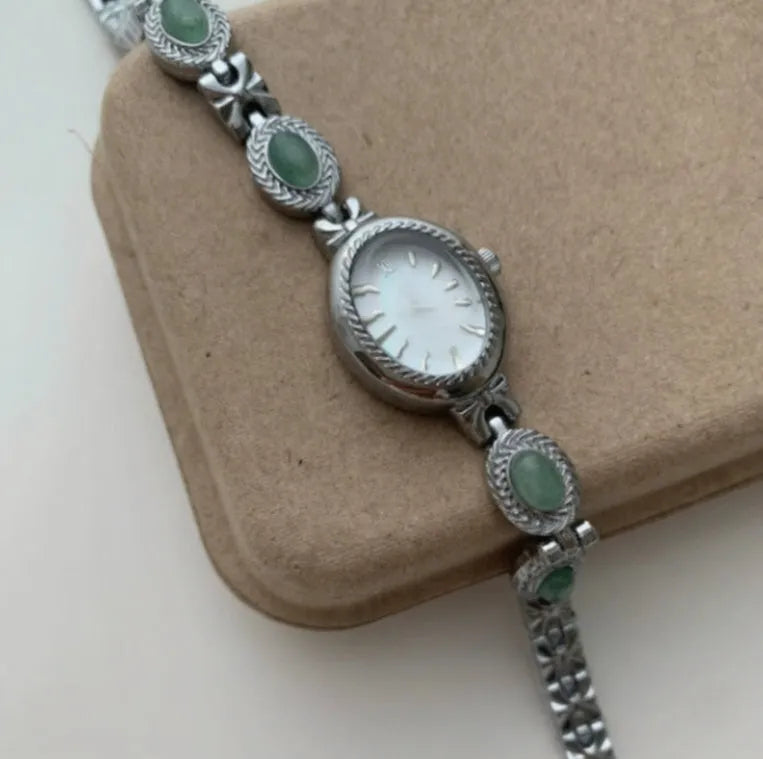 Ladies quartz watch with green jade silver finish and white dial face