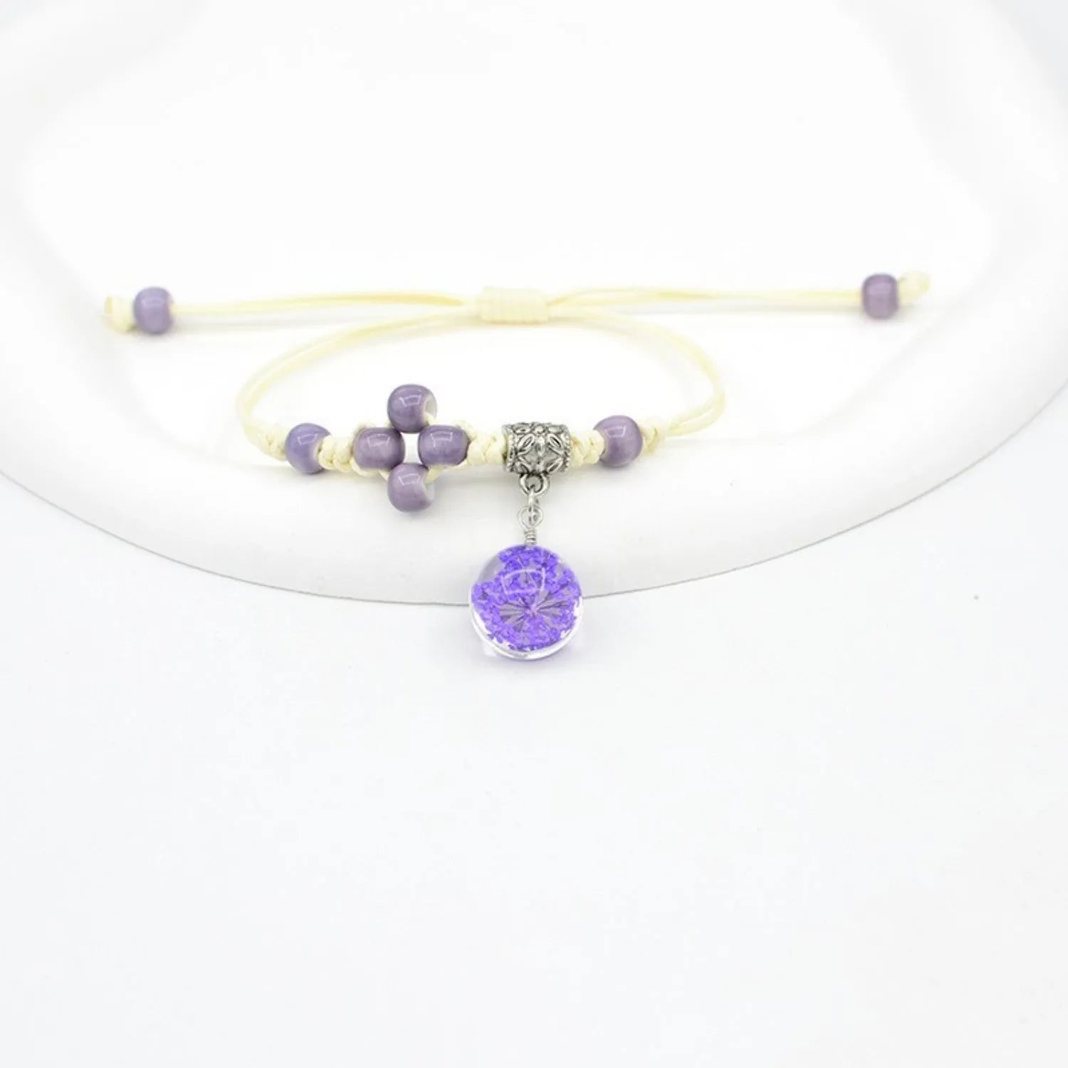 Glass bracelet with dried flowers inside 1.4cm beads on lace-style band in multiple colour options