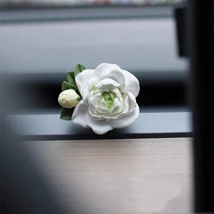 Solid gypsum car vent air freshener in jasmine fragrance, showing off-white or green colour.