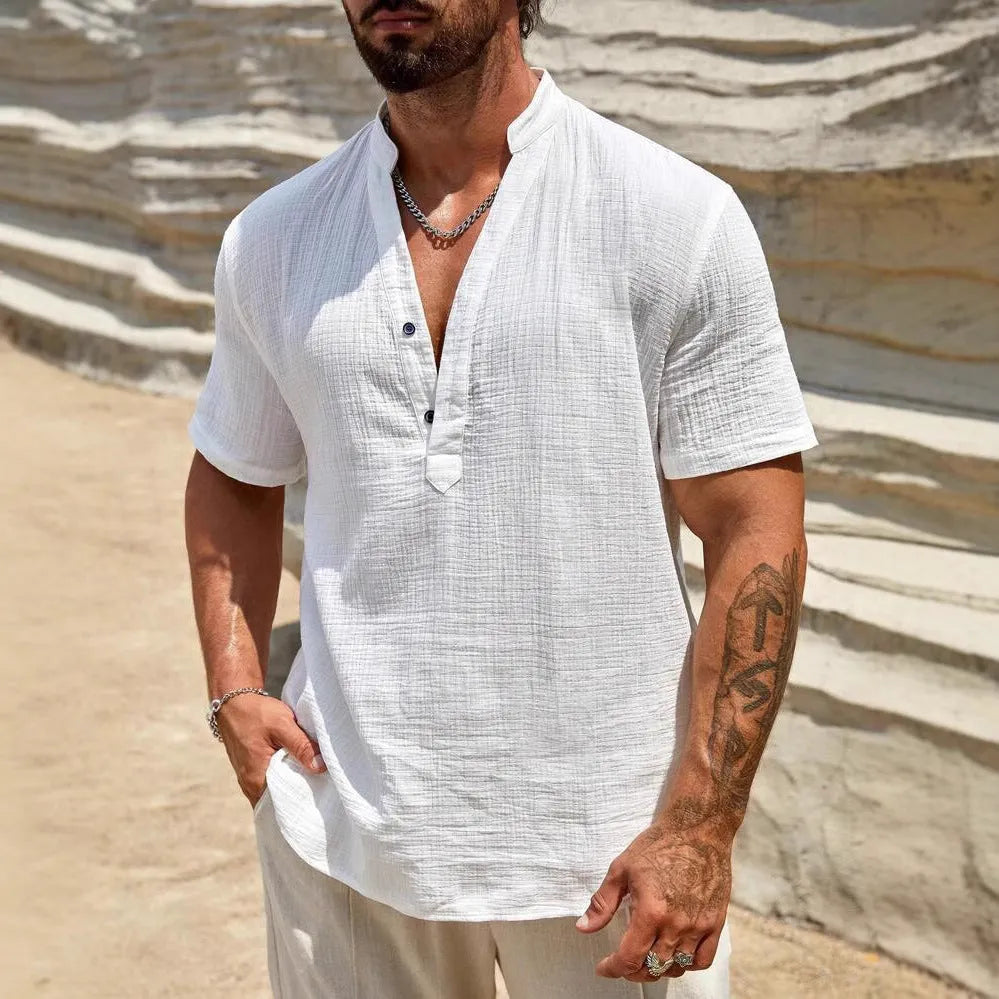 Men's solid colour stand collar short-sleeved shirt laid flat.
