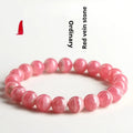 Women's crystal bracelet with red rhodochrosite stones in geometric design featuring longevity lock element