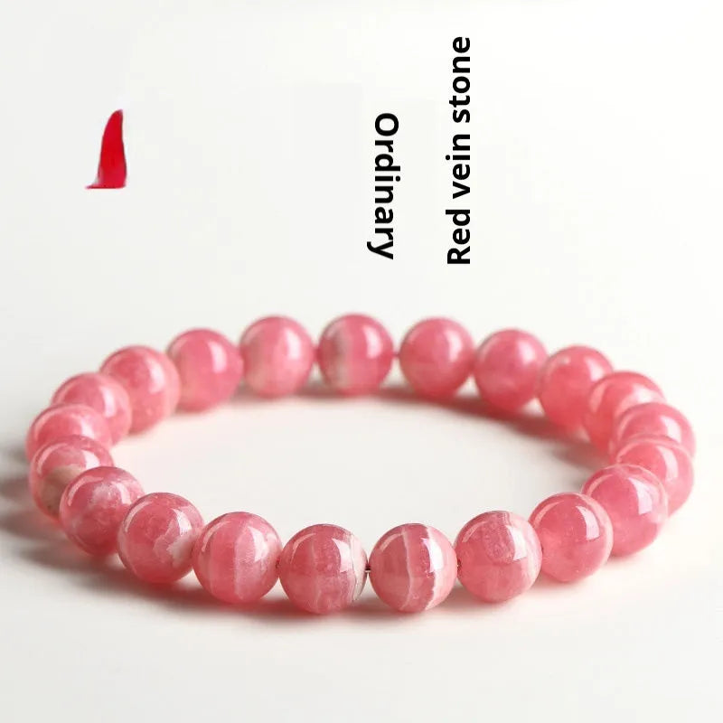 Women's crystal bracelet with red rhodochrosite stones in geometric design featuring longevity lock element