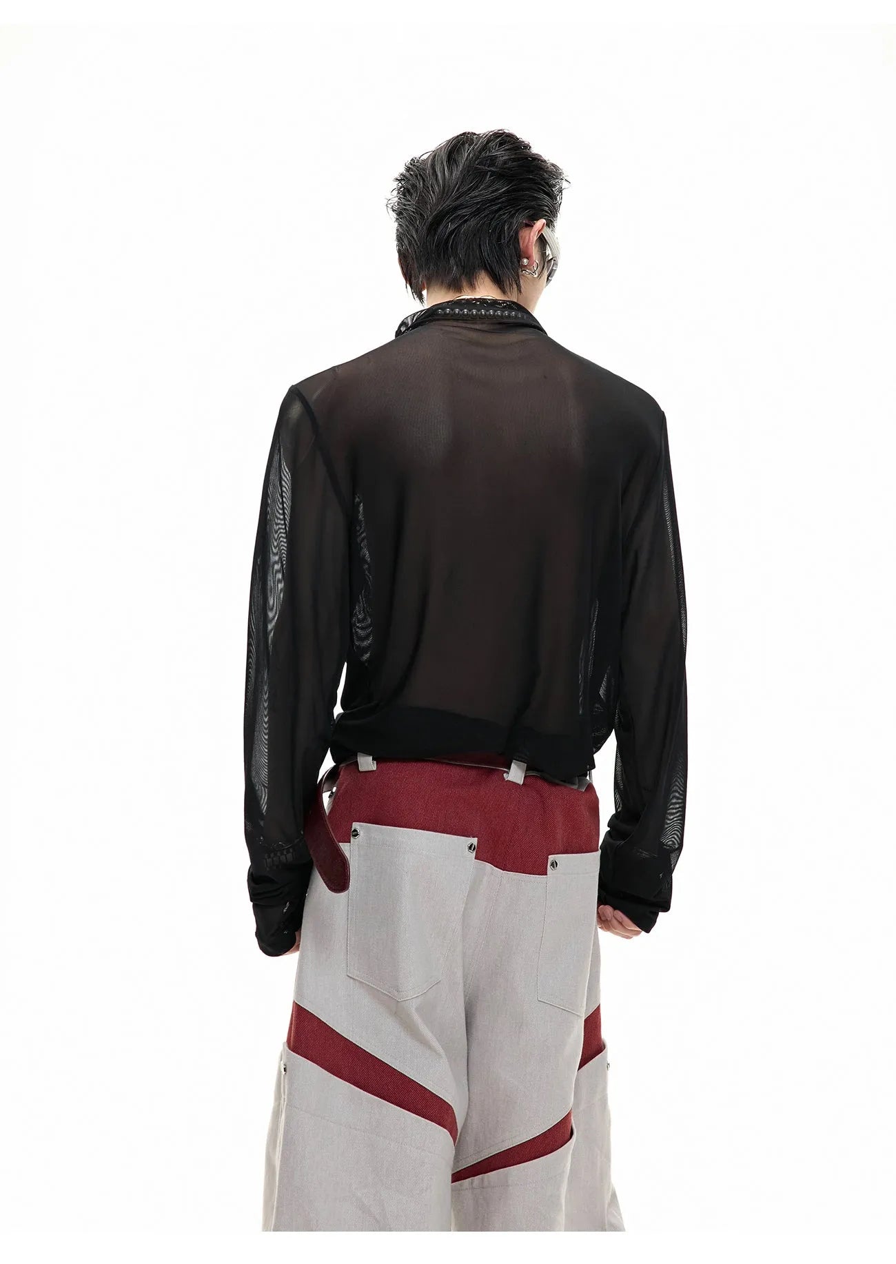 Black mesh slim-fit long sleeve base layer shirt laid flat, showing its texture and cut.