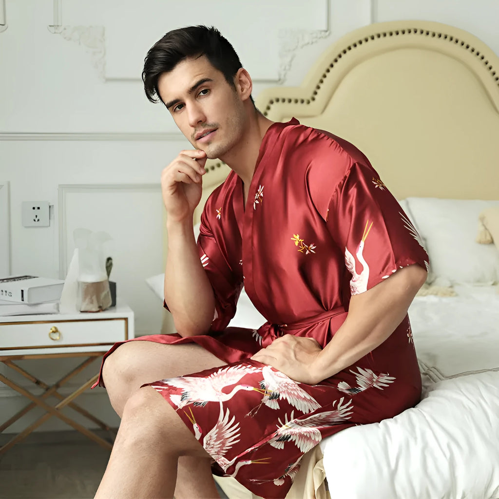 Mid-length printed artificial silk men's nightgown in cardigan style, black colour, on a hanger