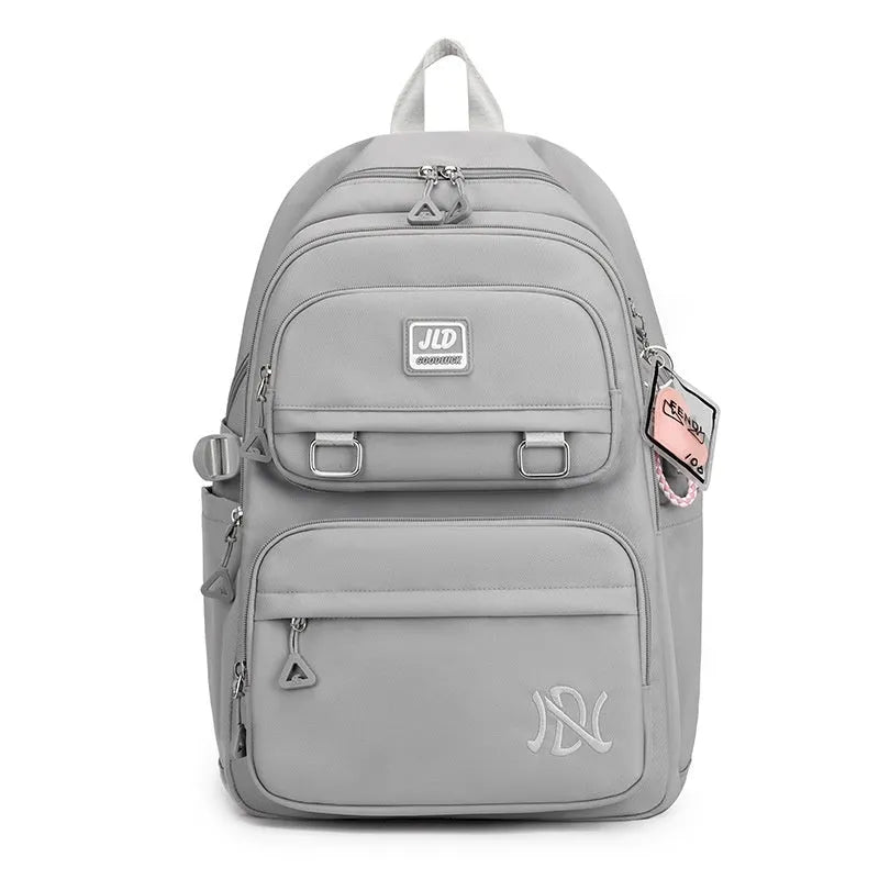 Large capacity nylon school backpack for girls in a choice of colours and patterns, showing ergonomic backplate.