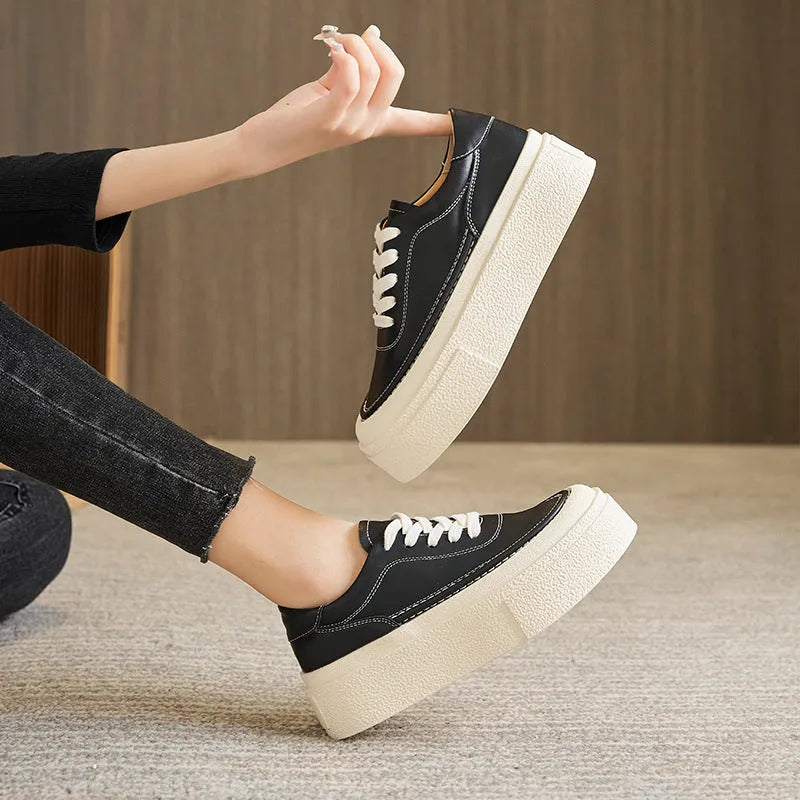 Women's black platform sports shoes with embossed cowhide leather upper and rubber sole